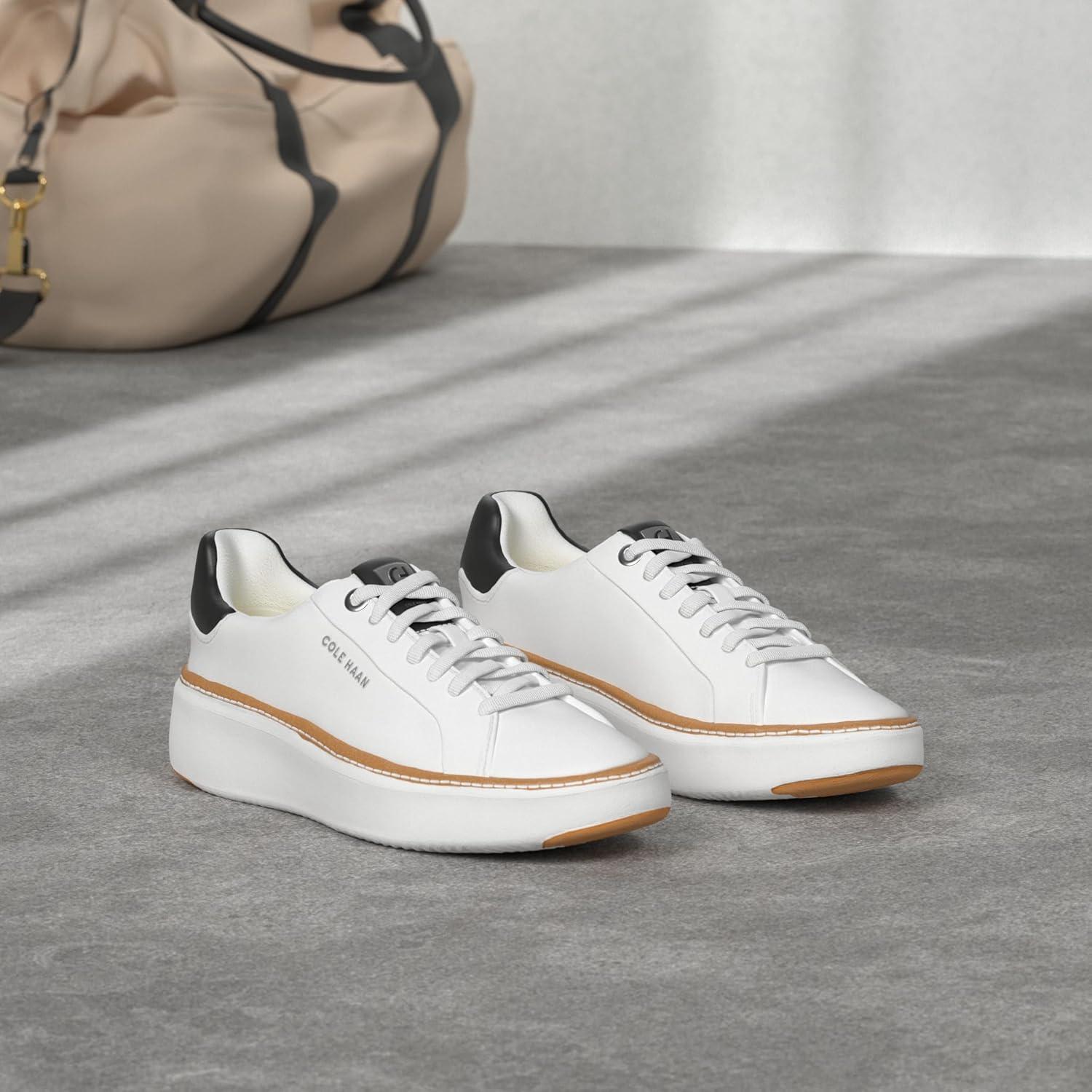 image:imageCole Haan Womens Grandpro Topspin SneakersIvoryBlack Leather