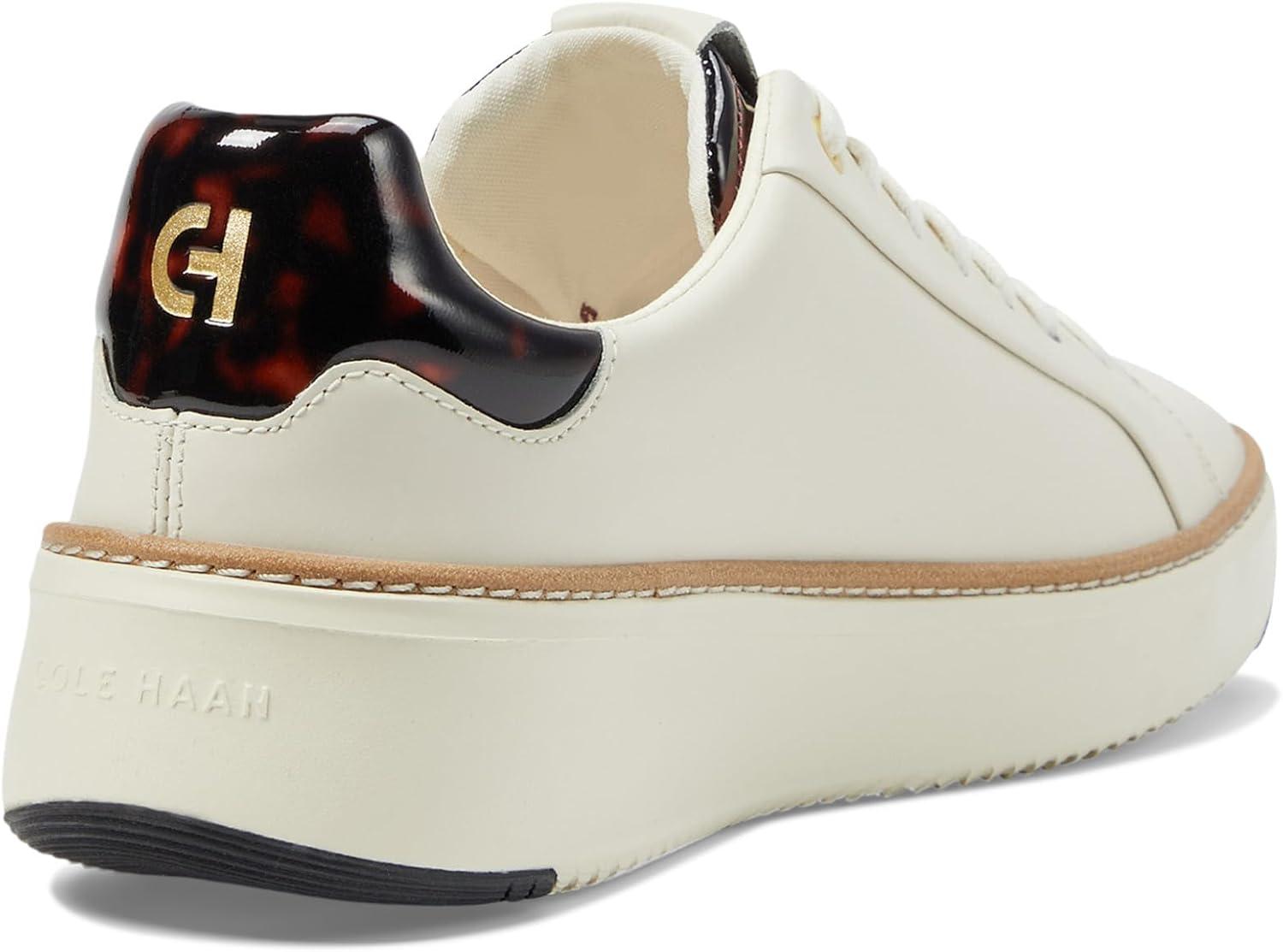image:imageCole Haan Womens Grandpro Topspin SneakersIvoryTortse Paten